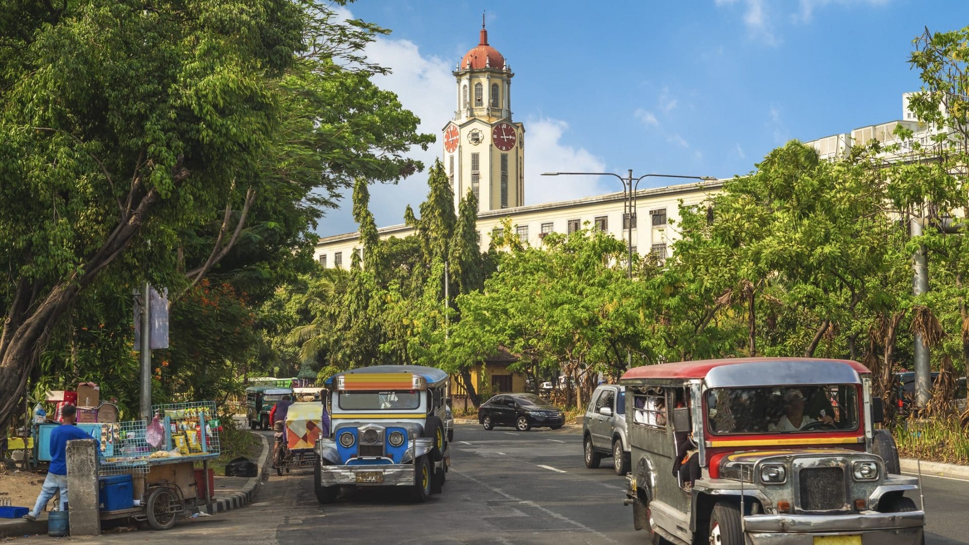 Street View Of Manila With Jeepney And Clock Tower